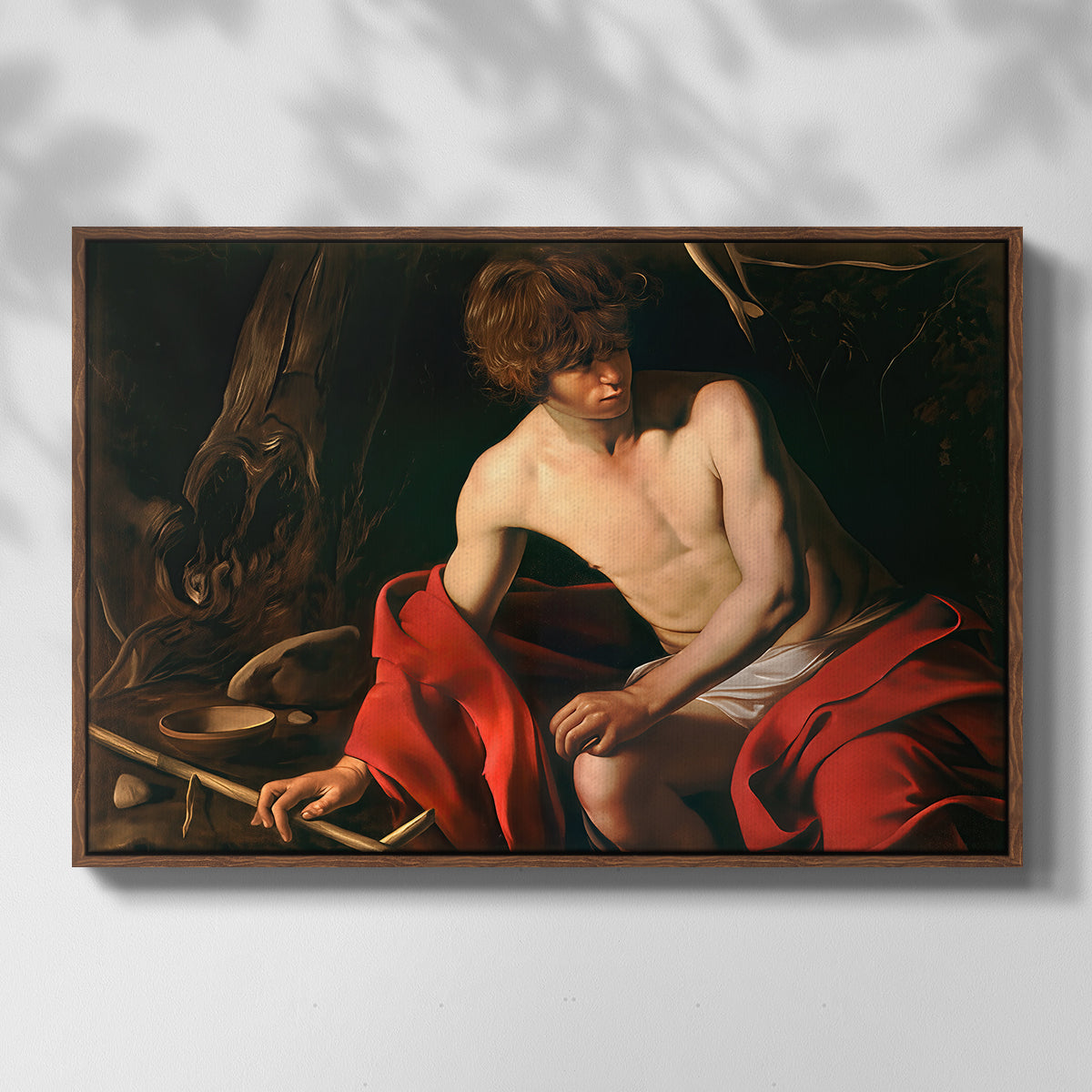 Front view of Saint John the Baptist in the Wilderness, c. 1603-1604 by Caravaggio in a walnut floater framed canvas.