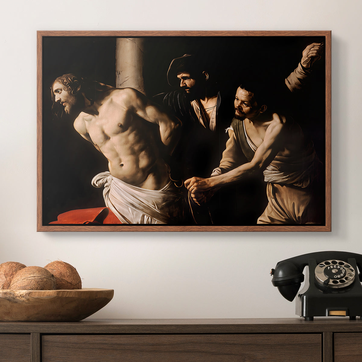 The Flagellation of Christ at the Column (Rouen Version), 1606 by Caravaggio in a walnut floater framed canvas displayed above a console table in a hallway, featuring an intense Baroque scene of suffering with strong light and shadow.