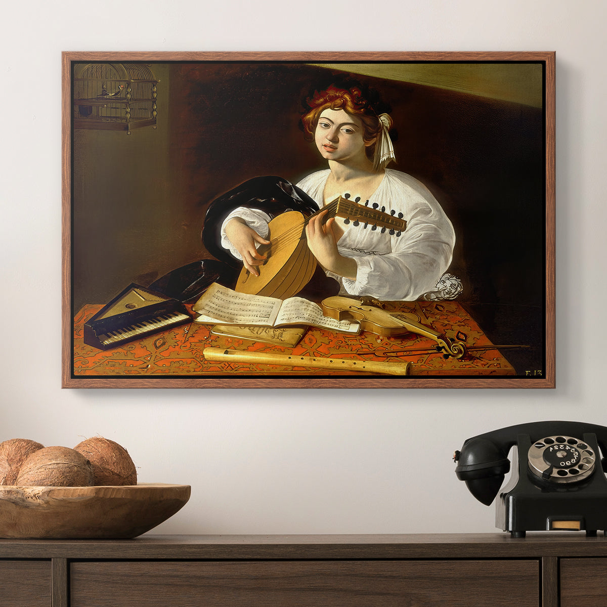 The Lute Player (Wildenstein Version), c. 1596 by Caravaggio in a walnut floater framed canvas displayed above a console table in a hallway, featuring an intimate portrait of musician with still life elements.