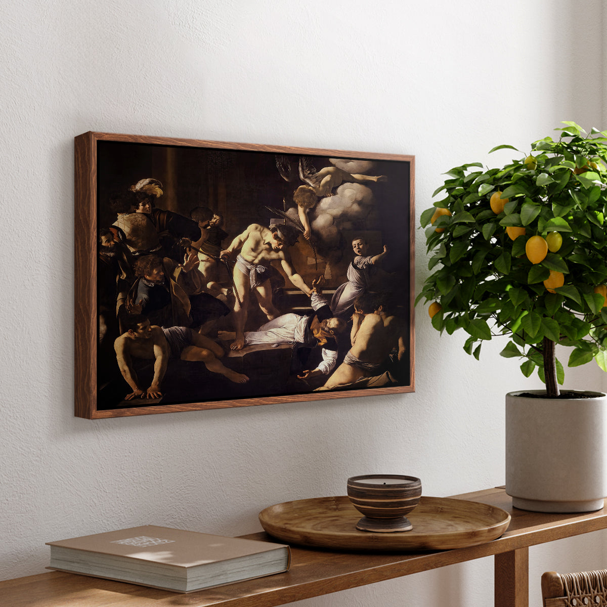 The Martyrdom of Saint Matthew, 1599-1600 by Caravaggio, presented in a walnut floater framed canvas featuring a chaotic scene of Saint Matthew being attacked by executioner in church, displayed above a hallway console table.