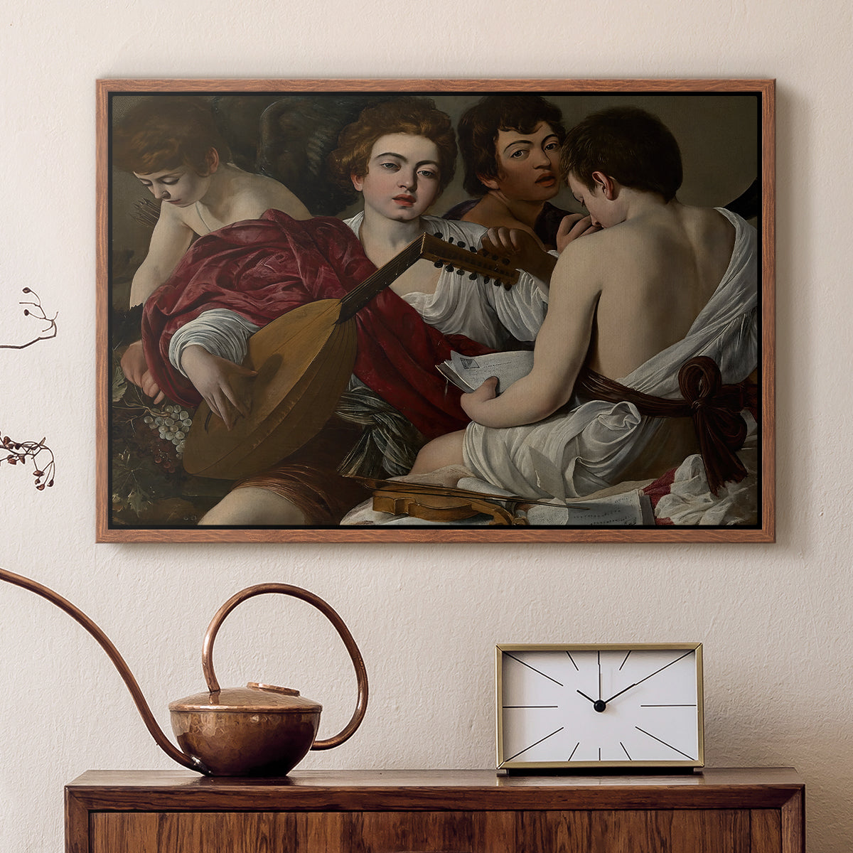 Walnut floater framed canvas featuring an intimate scene of youths making music with sheet music and instruments, displayed above a cabinet in a soft-toned living room.