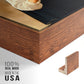Close-up of the walnut floater frame corner and gallery wrapped canvas construction.