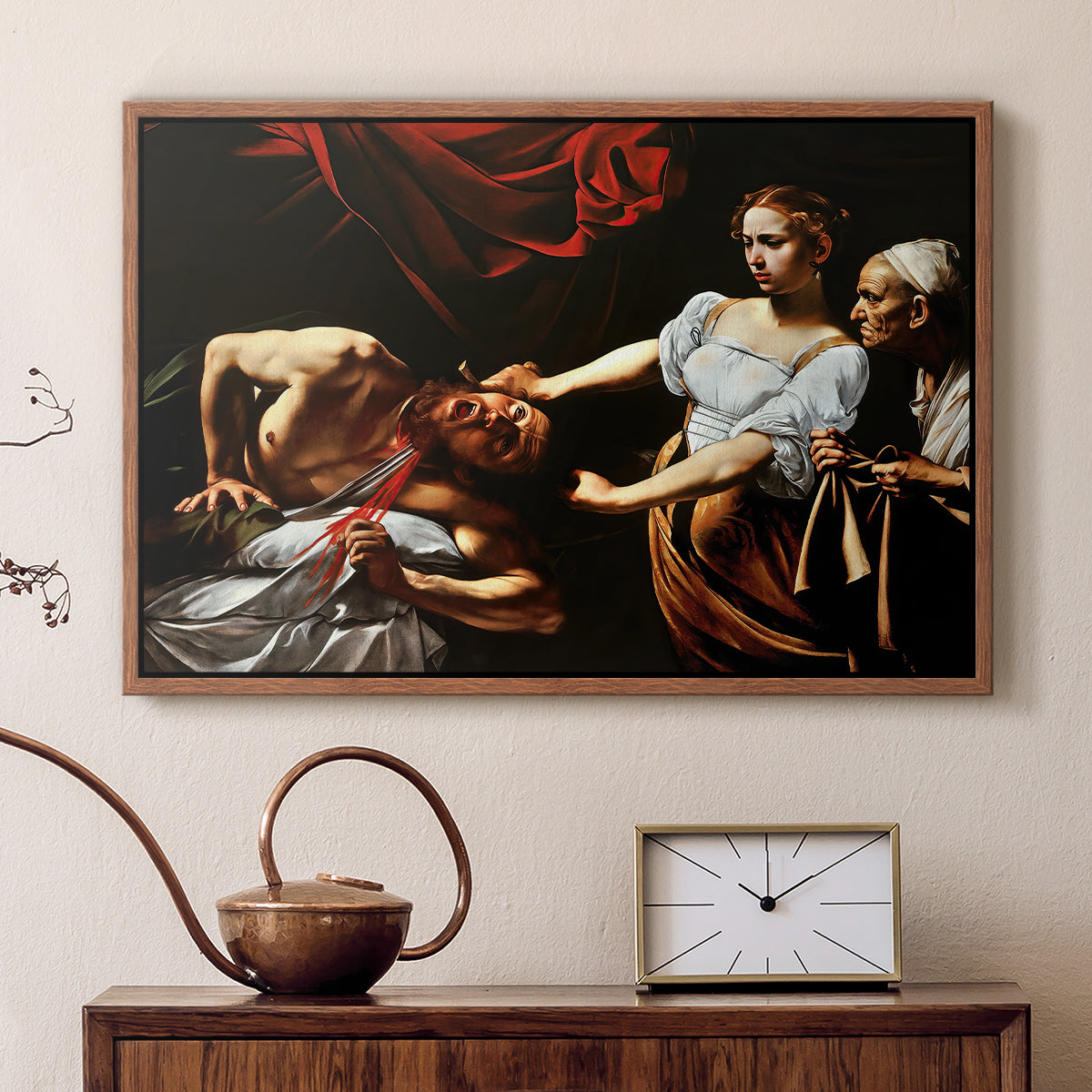 Walnut floater framed canvas featuring an intense moment of Judith slaying Holofernes with sword, displayed above a cabinet in a soft-toned living room.