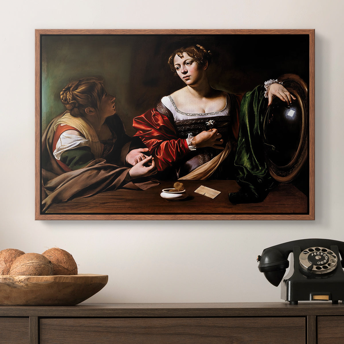 Martha and Mary Magdalene, c. 1598 by Caravaggio in a walnut floater framed canvas displayed above a console table in a hallway, featuring a religious interior scene with figures engaged in thoughtful dialogue.