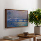 Charing Cross Bridge, 1903 by Claude Monet, presented in a walnut floater framed canvas featuring an impressionist view of bridge stretching across river with soft light and haze, displayed above a hallway console table.