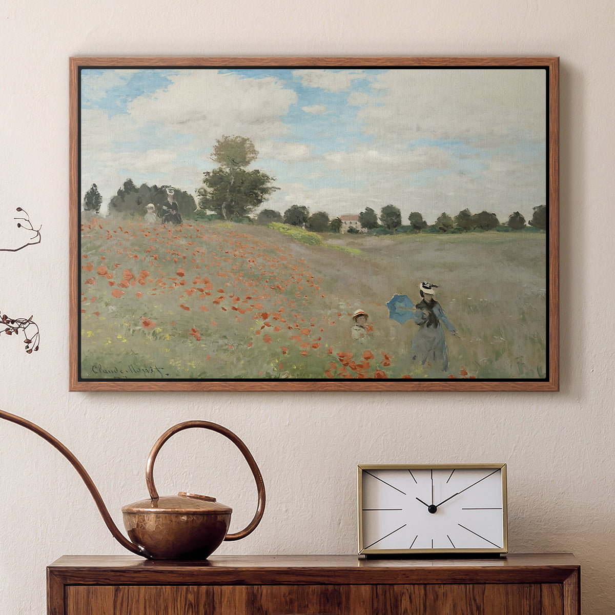 Walnut floater framed canvas featuring a bright meadow filled with poppies under open sky, displayed above a cabinet in a soft-toned living room.
