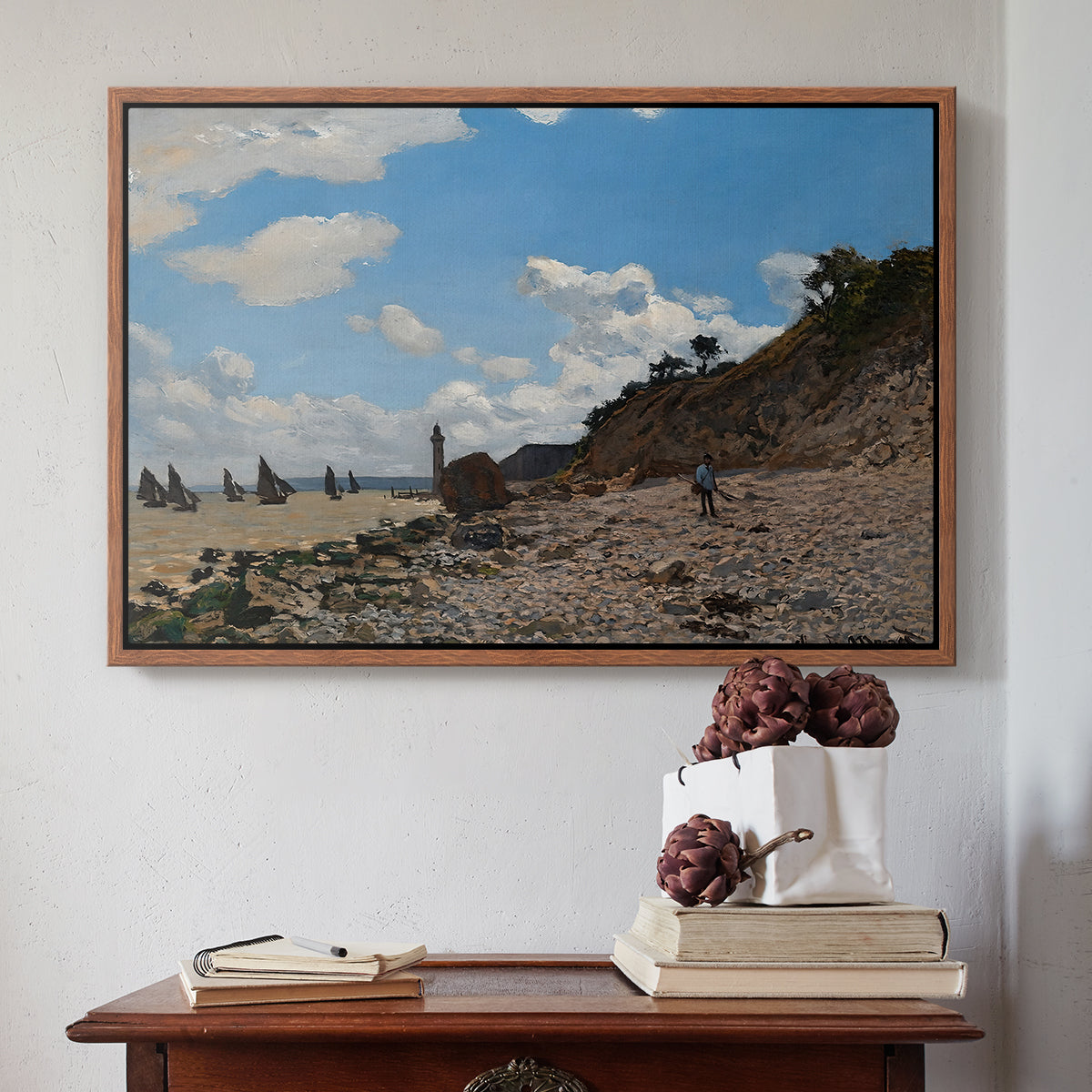 Walnut floater framed canvas featuring The Beach at Honfleur, 1864 by Claude Monet above an entryway table in a minimalist foyer.