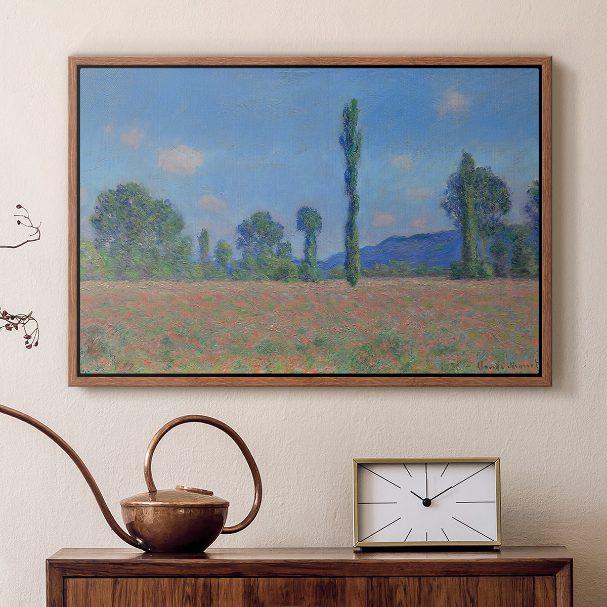 Walnut floater framed canvas featuring a vibrant meadow scene with flowers and vertical tree forms, displayed above a cabinet in a soft-toned living room.