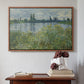 Walnut floater framed canvas featuring Banks of the Seine, Vétheuil, 1880 by Claude Monet above an entryway table in a minimalist foyer.