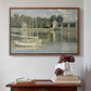 Walnut floater framed canvas featuring The Bridge at Argenteuil, 1874 by Claude Monet above an entryway table in a minimalist foyer.