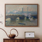 Walnut floater framed canvas featuring a river and bridge scene with diffused light and urban backdrop, displayed above a cabinet in a soft-toned living room.