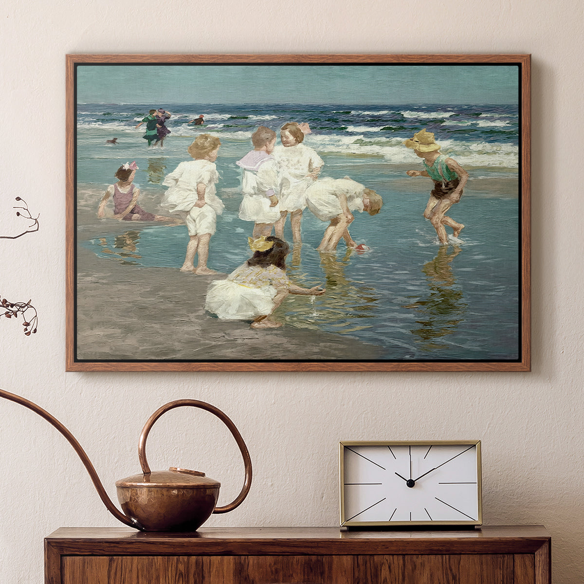Walnut floater framed canvas featuring an impressionist coastal view of families enjoying seaside water, displayed above a cabinet in a soft-toned living room.