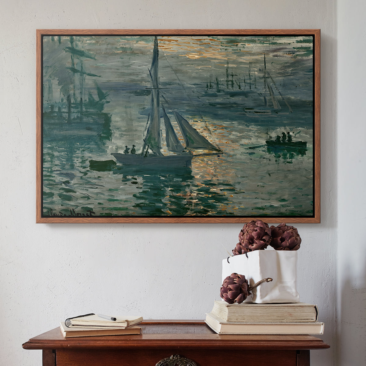 Walnut floater framed canvas featuring Sunrise (Marine), 1873 by Claude Monet above an entryway table in a minimalist foyer.