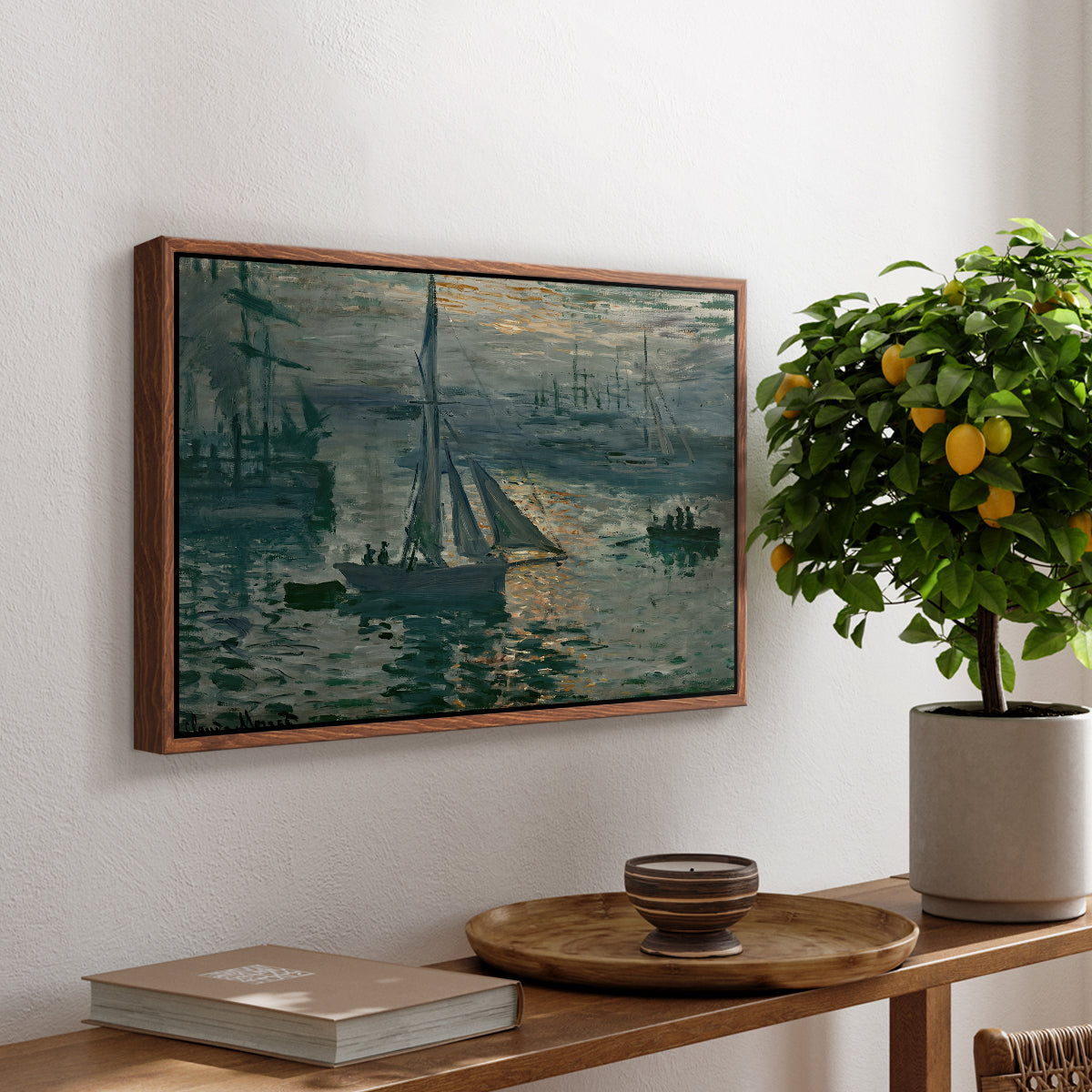 Sunrise (Marine), 1873 by Claude Monet, presented in a walnut floater framed canvas featuring a hazy sunrise over harbor with boats silhouetted in soft morning light, displayed above a hallway console table.