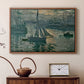 Walnut floater framed canvas featuring an early morning harbor scene with boats and diffused light, displayed above a cabinet in a soft-toned living room.