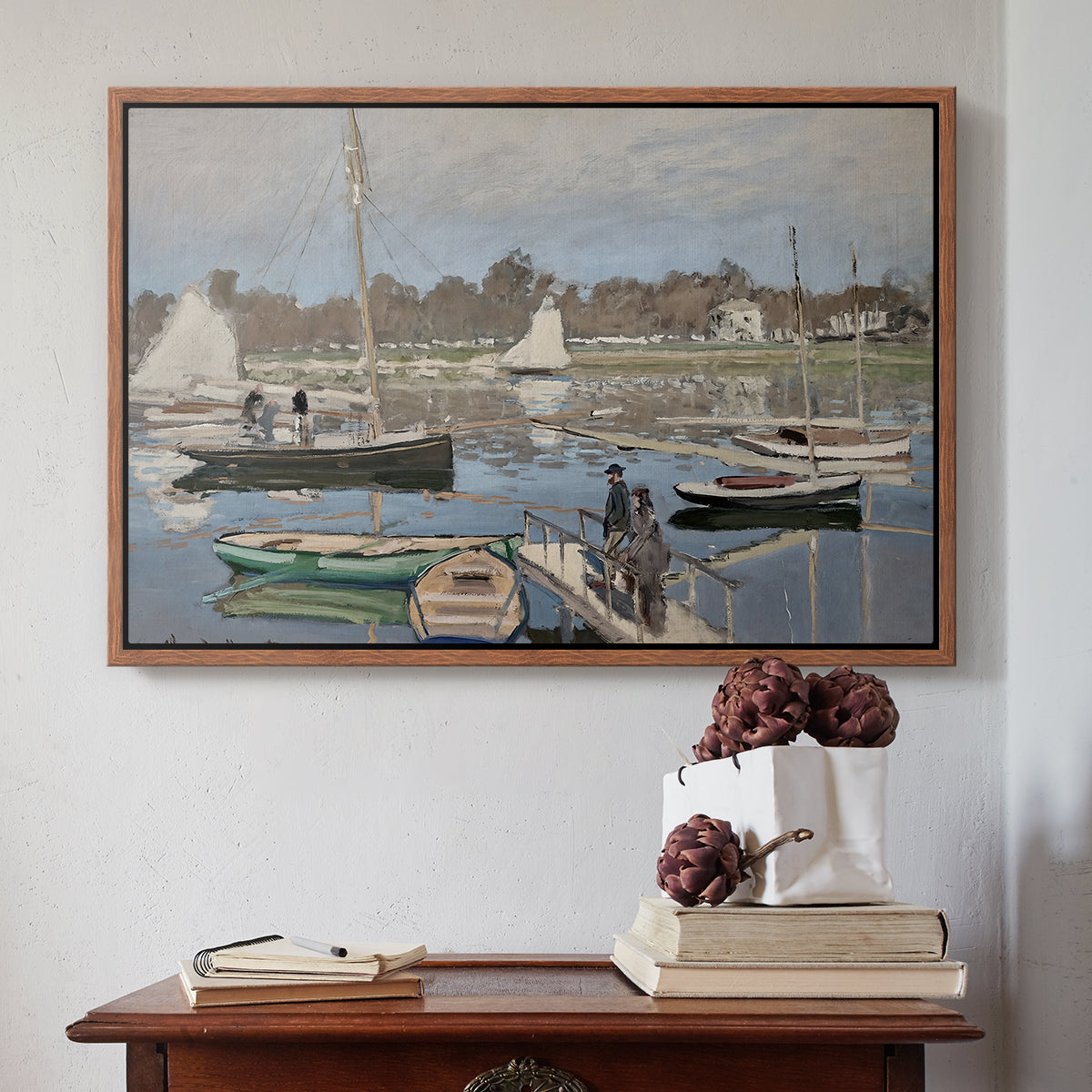 Walnut floater framed canvas featuring The Basin at Argenteuil, 1874 by Claude Monet above an entryway table in a minimalist foyer.
