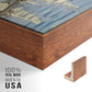Close-up of the walnut floater frame corner and gallery wrapped canvas construction.