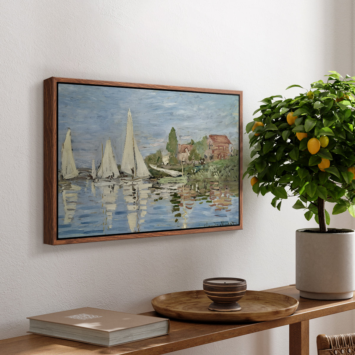 Regatta at Argenteuil, 1872 by Claude Monet, presented in a walnut floater framed canvas featuring colorful sailboats racing across river under bright sky, displayed above a hallway console table.