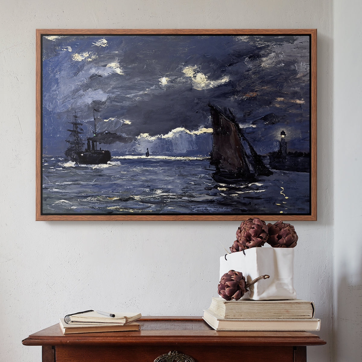 Walnut floater framed canvas featuring A Seascape, Shipping by Moonlight, 1864 by Claude Monet above an entryway table in a minimalist foyer.