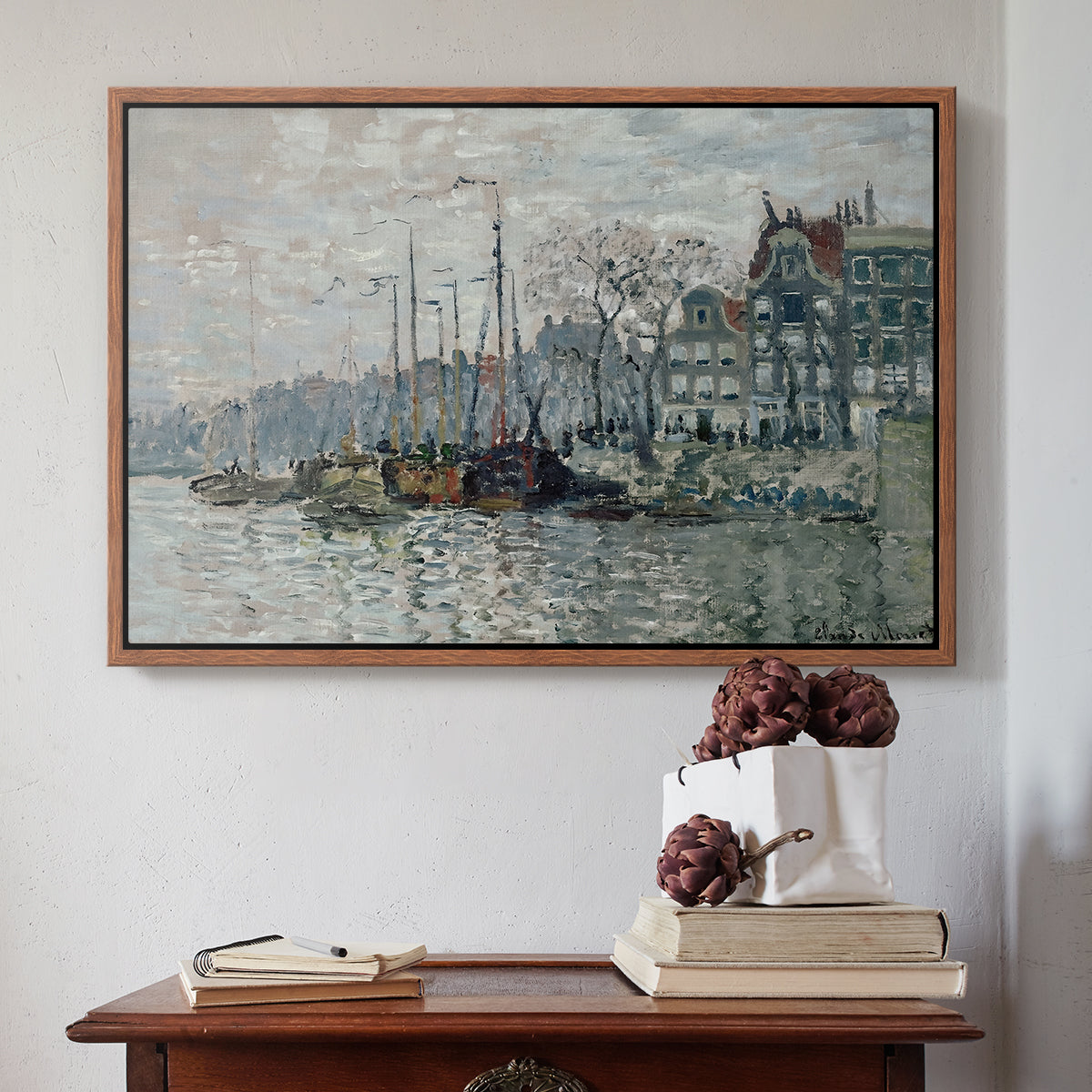 Walnut floater framed canvas featuring View of the Prins Hendrikkade and Kromme Waal in Amsterdam, 1874 by Claude Monet above an entryway table in a minimalist foyer.