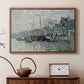 Walnut floater framed canvas featuring an urban waterway with docked boats and European buildings, displayed above a cabinet in a soft-toned living room.
