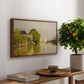 Houses on the Achterzaan, 1871 by Claude Monet, presented in a walnut floater framed canvas featuring colorful houses reflected in calm river surrounded by greenery, displayed above a hallway console table.