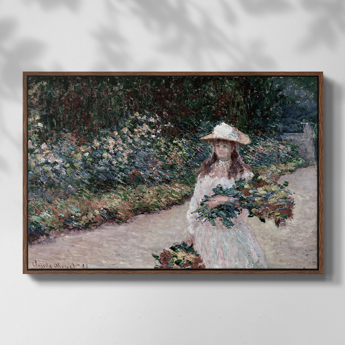 Front view of Young Girl in the Garden at Giverny, 1888 by Claude Monet in a walnut floater framed canvas.