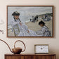 Walnut floater framed canvas featuring a beach setting with people relaxing under umbrellas, displayed above a cabinet in a soft-toned living room.