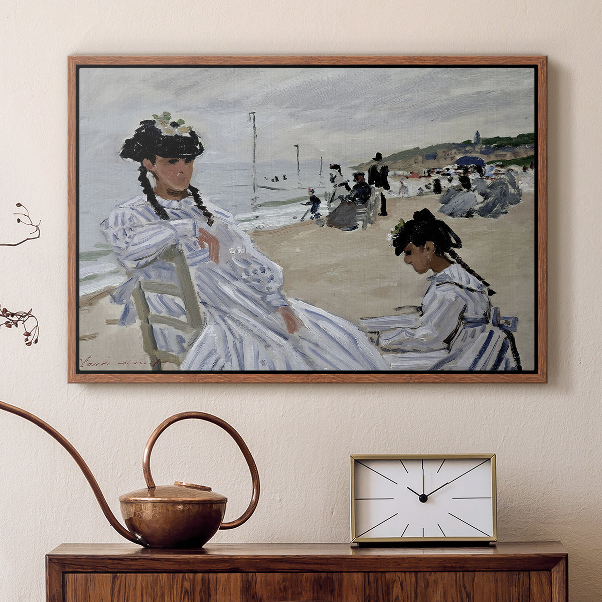 Walnut floater framed canvas featuring a beach setting with people relaxing under umbrellas, displayed above a cabinet in a soft-toned living room.