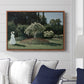 Woman in the Garden, Sainte-Adresse, 1867 by Claude Monet displayed above a sofa in a living room in a walnut floater frame, featuring an impressionist figure in sunlit garden with lush vegetation.