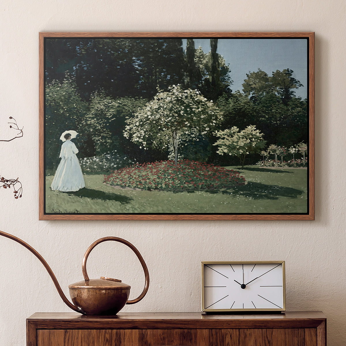 Walnut floater framed canvas featuring an elegant woman posed outdoors among blooming plants, displayed above a cabinet in a soft-toned living room.