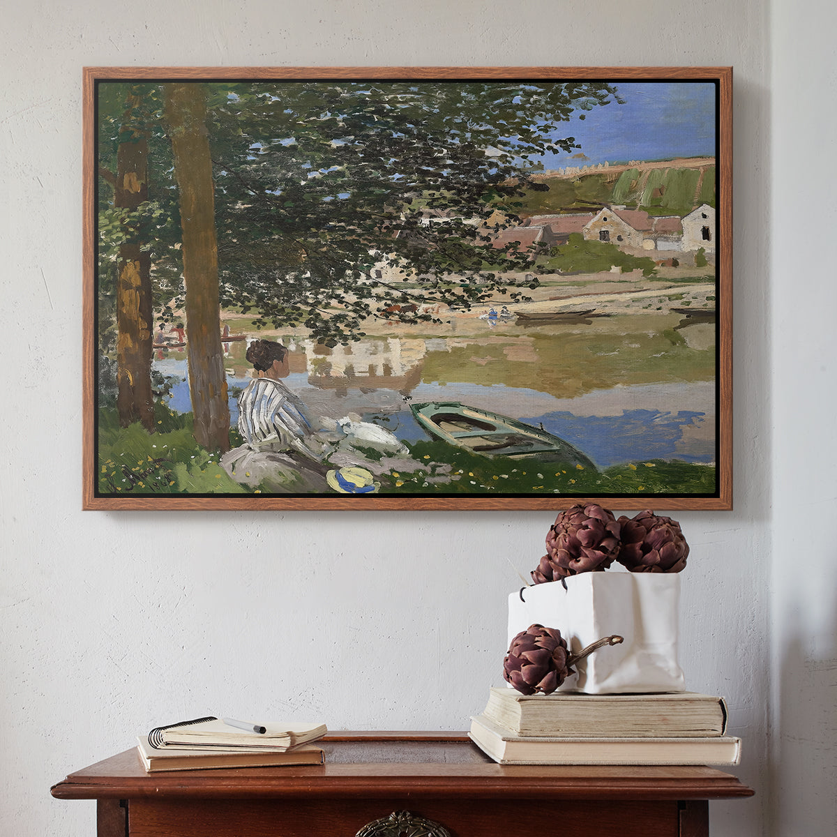 Walnut floater framed canvas featuring On the Bank of the Seine, Bennecourt, 1868 by Claude Monet above an entryway table in a minimalist foyer.