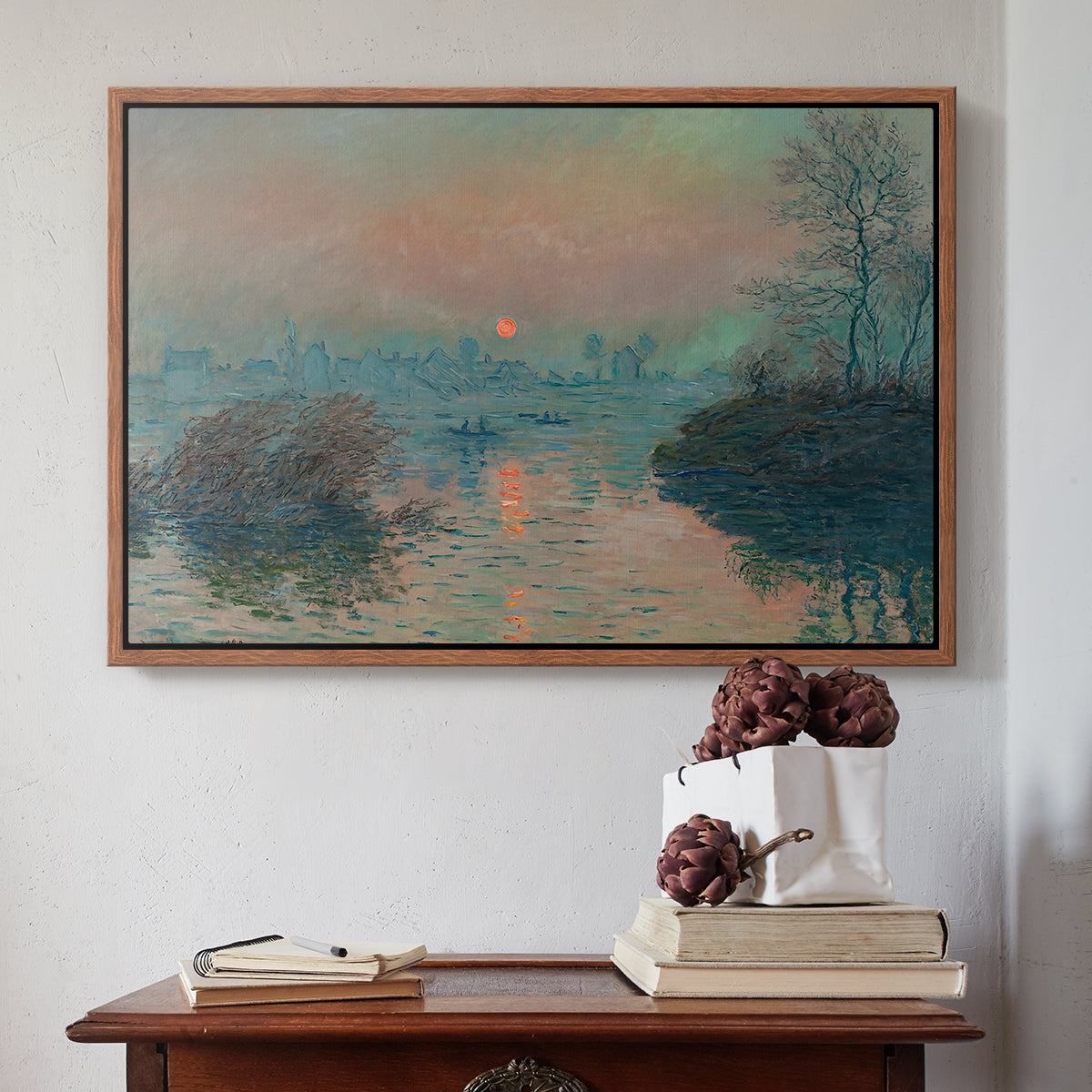 Walnut floater framed canvas featuring Sunset on the Seine at Lavacourt, Winter Effect, 1880 by Claude Monet above an entryway table in a minimalist foyer.