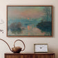Walnut floater framed canvas featuring an impressionist view of river at sunset with snowy banks, displayed above a cabinet in a soft-toned living room.