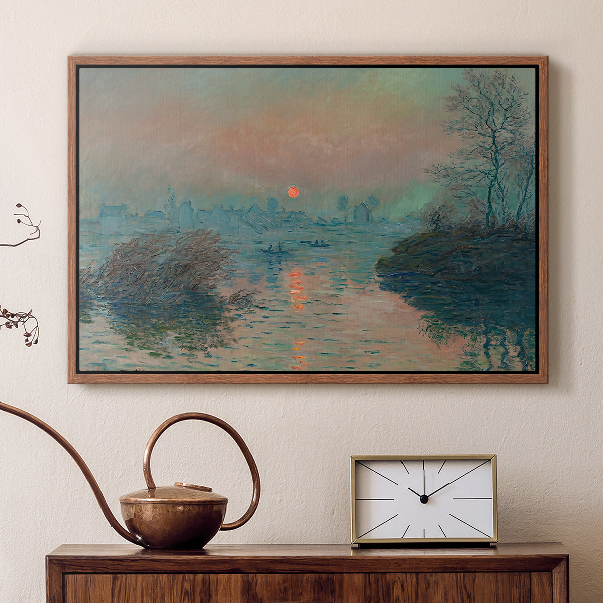 Walnut floater framed canvas featuring an impressionist view of river at sunset with snowy banks, displayed above a cabinet in a soft-toned living room.
