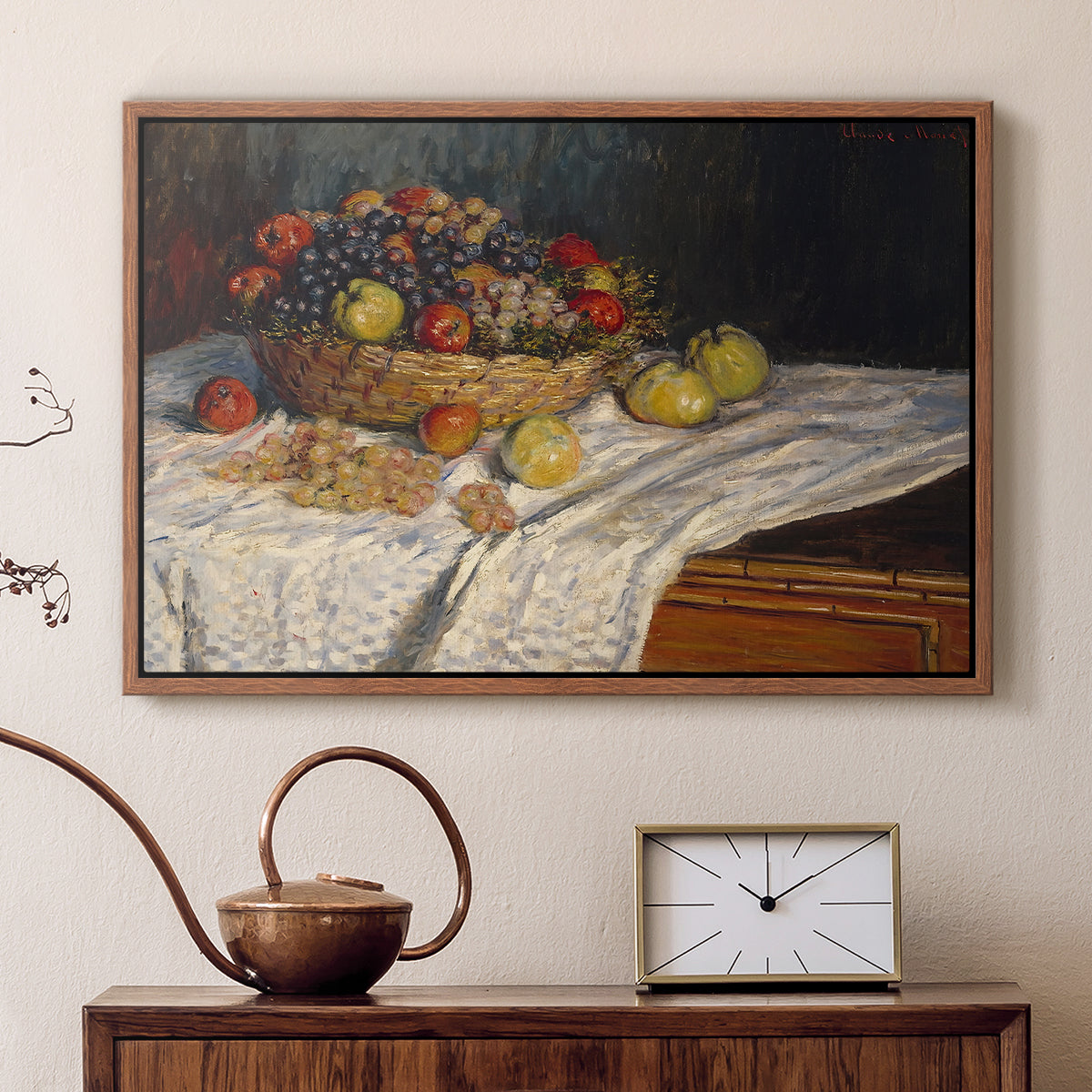 Walnut floater framed canvas featuring a close-up of apples and grapes in warm tones, displayed above a cabinet in a soft-toned living room.