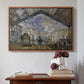 Walnut floater framed canvas featuring The Gare Saint-Lazare, 1877 by Claude Monet above an entryway table in a minimalist foyer.