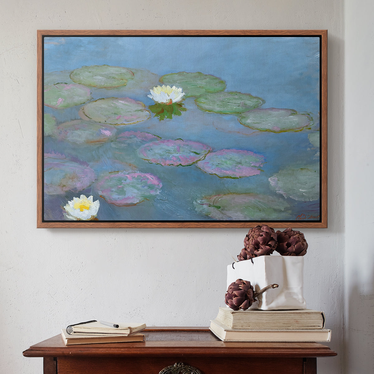 Walnut floater framed canvas featuring Water Lilies (Nymphéas), 1897-1899 by Claude Monet above an entryway table in a minimalist foyer.
