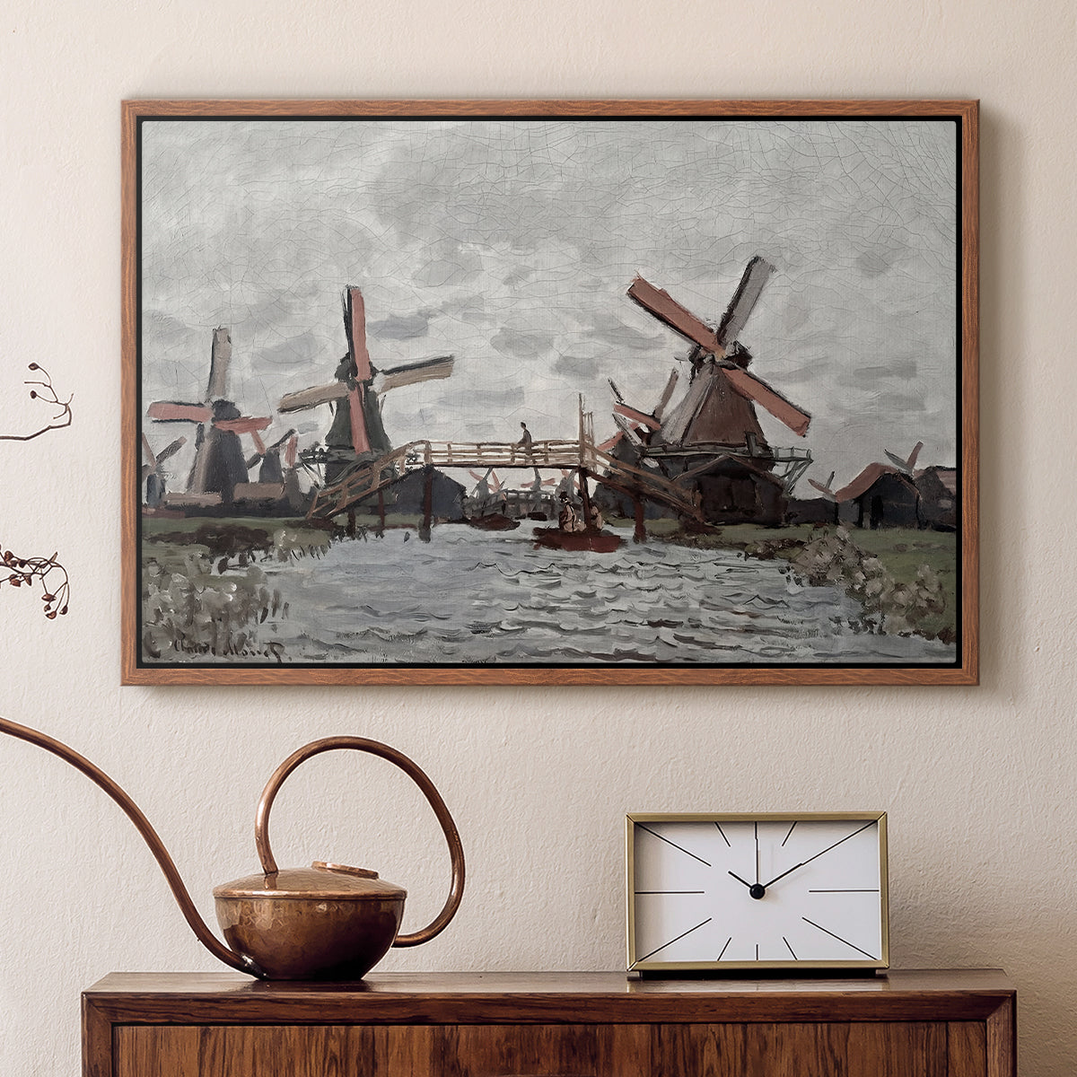 Walnut floater framed canvas featuring a countryside scene with traditional windmills and reflections, displayed above a cabinet in a soft-toned living room.