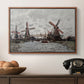 Windmills near Zaandam, 1871 by Claude Monet in a walnut floater framed canvas displayed above a console table in a hallway, featuring a landscape featuring windmills and low horizon sky.