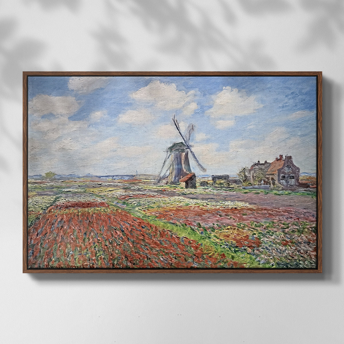 Front view of Tulip Fields with the Rijnsburg Windmill, 1886 by Claude Monet in a walnut floater framed canvas.