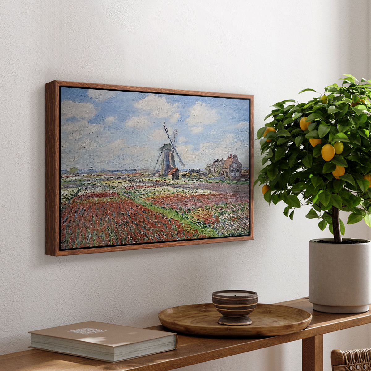 Tulip Fields with the Rijnsburg Windmill, 1886 by Claude Monet, presented in a walnut floater framed canvas featuring colorful rows of tulip fields leading toward distant windmill, displayed above a hallway console table.
