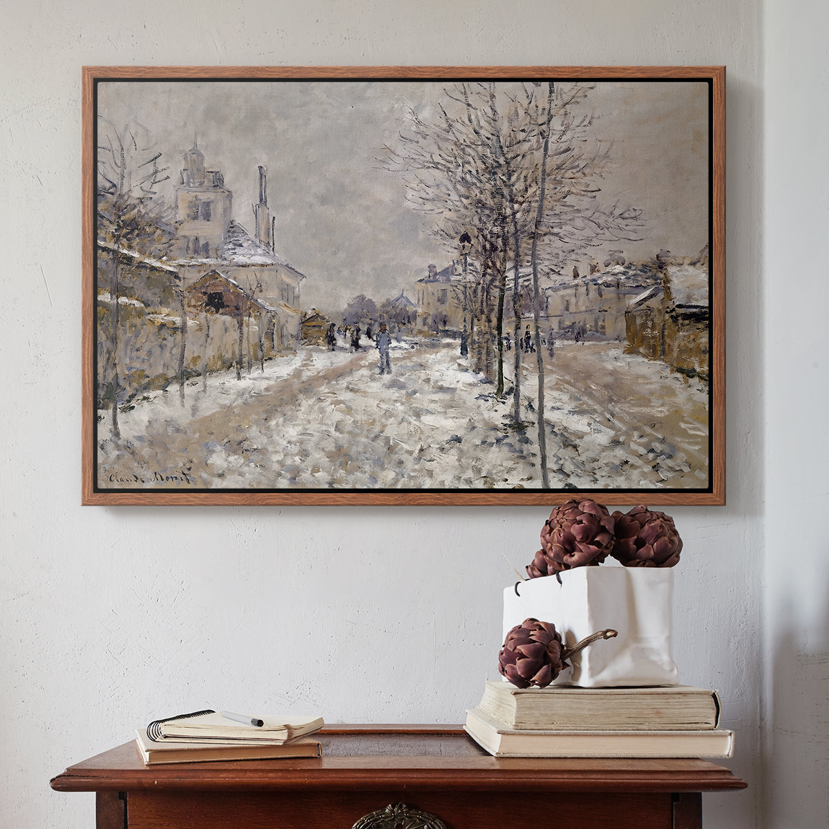 Walnut floater framed canvas featuring The Boulevard de Pontoise at Argenteuil, Snow Effect, 1875 by Claude Monet above an entryway table in a minimalist foyer.