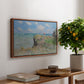 The Cliff Walk at Pourville, 1882 by Claude Monet, presented in a walnut floater framed canvas featuring figures walking along coastal cliff path overlooking ocean and sky, displayed above a hallway console table.