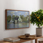 Houses on the Zaan River at Zaandam, 1871 by Claude Monet, presented in a walnut floater framed canvas featuring a row of houses along river with reflections in calm water, displayed above a hallway console table.