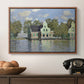 Houses on the Zaan River at Zaandam, 1871 by Claude Monet in a walnut floater framed canvas displayed above a console table in a hallway, featuring a waterfront architecture with still reflections.