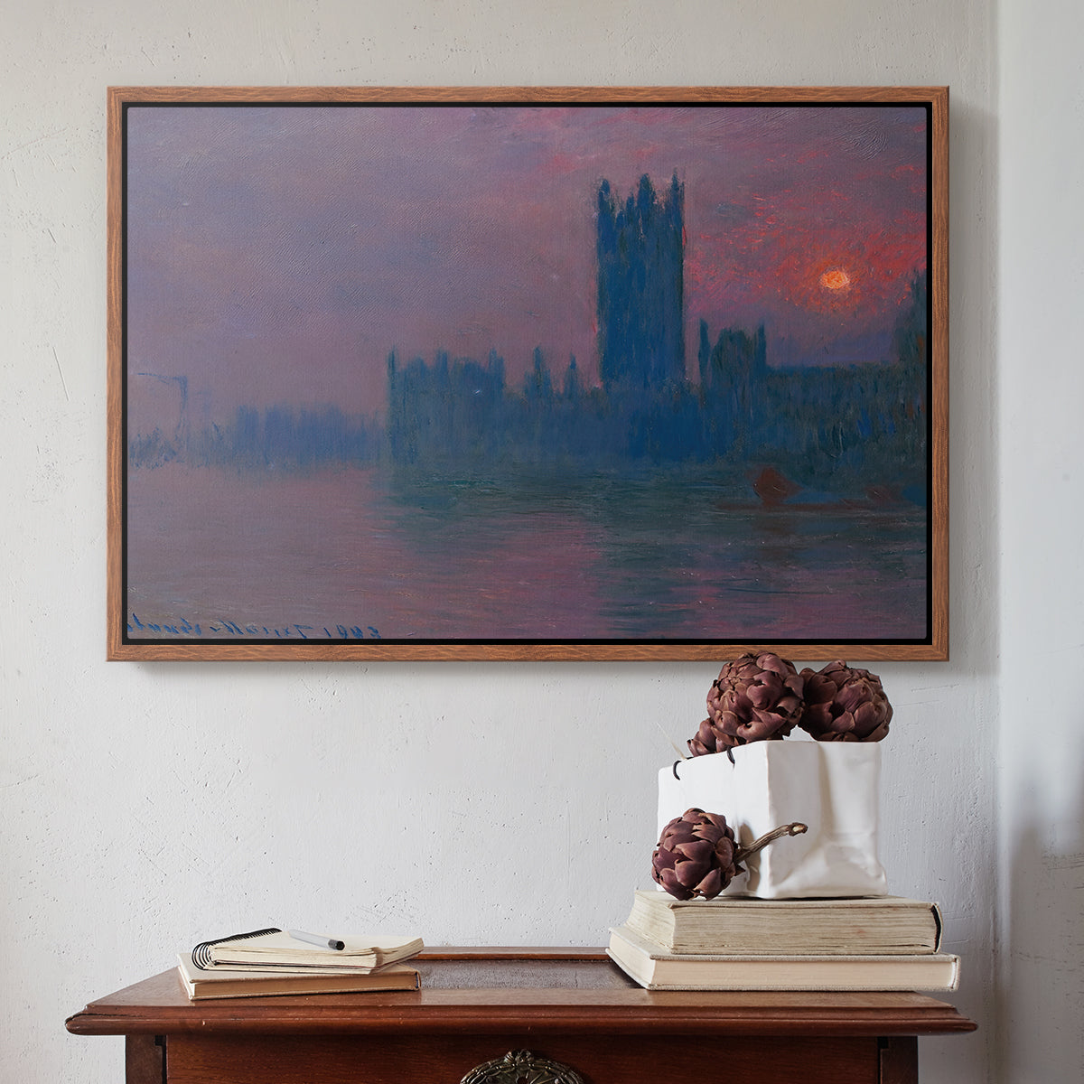 Walnut floater framed canvas featuring The Houses of Parliament, Sunset, 1903 by Claude Monet above an entryway table in a minimalist foyer.