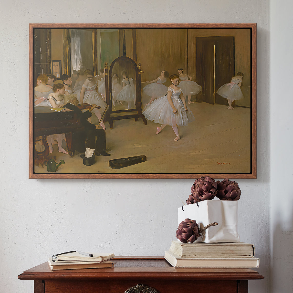Walnut floater framed canvas featuring The Dancing Class, c. 1870 by Edgar Degas above an entryway table in a minimalist foyer.