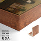 Close-up of the walnut floater frame corner and gallery wrapped canvas construction.