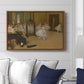 The Dancing Class, c. 1870 by Edgar Degas displayed above a sofa in a living room in a walnut floater frame, featuring a rehearsal scene with ballerinas in tutus arranged in studio.